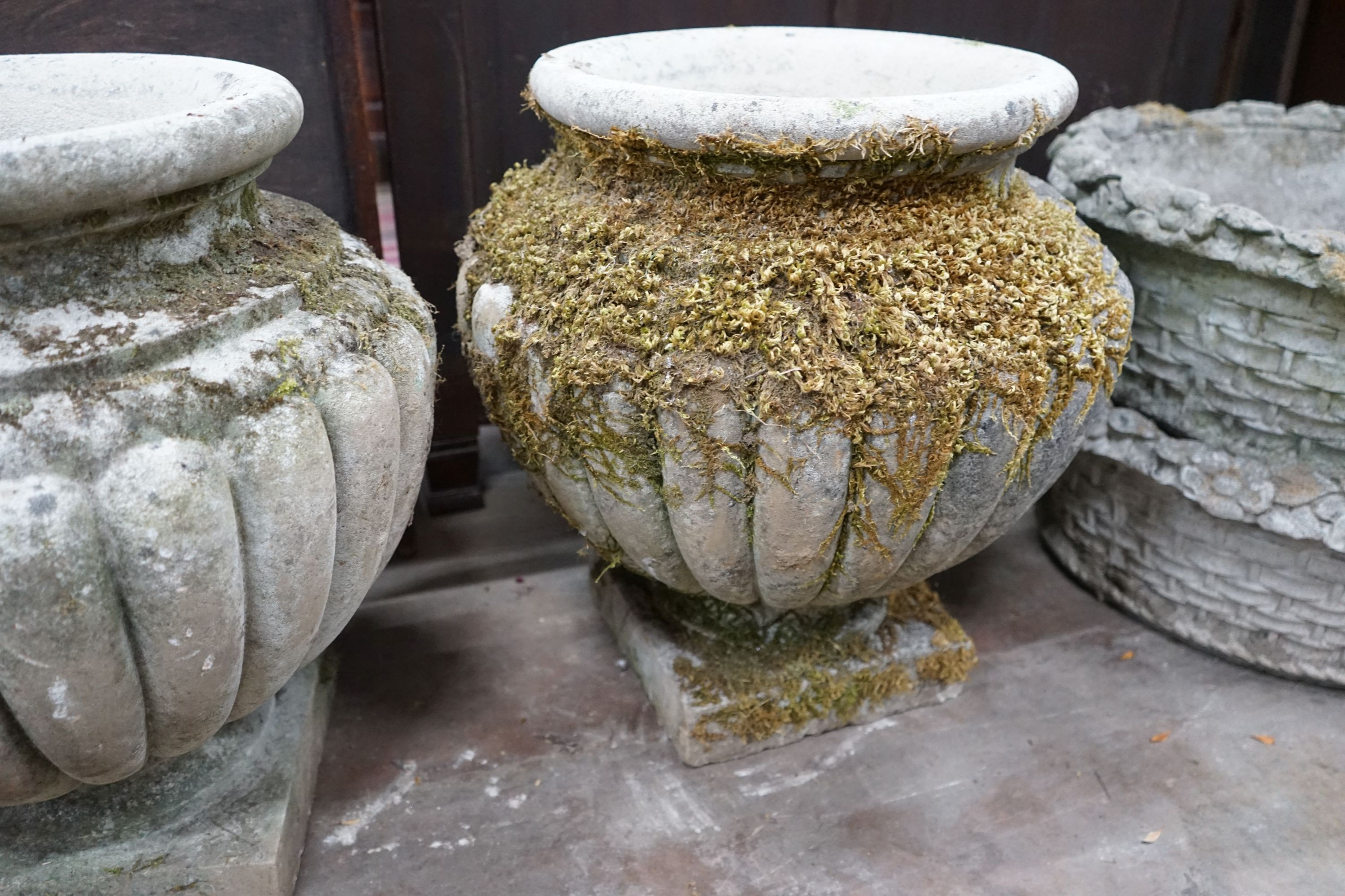 A pair of circular reconstituted stone garden planters, diameter 54cm, height 56cm